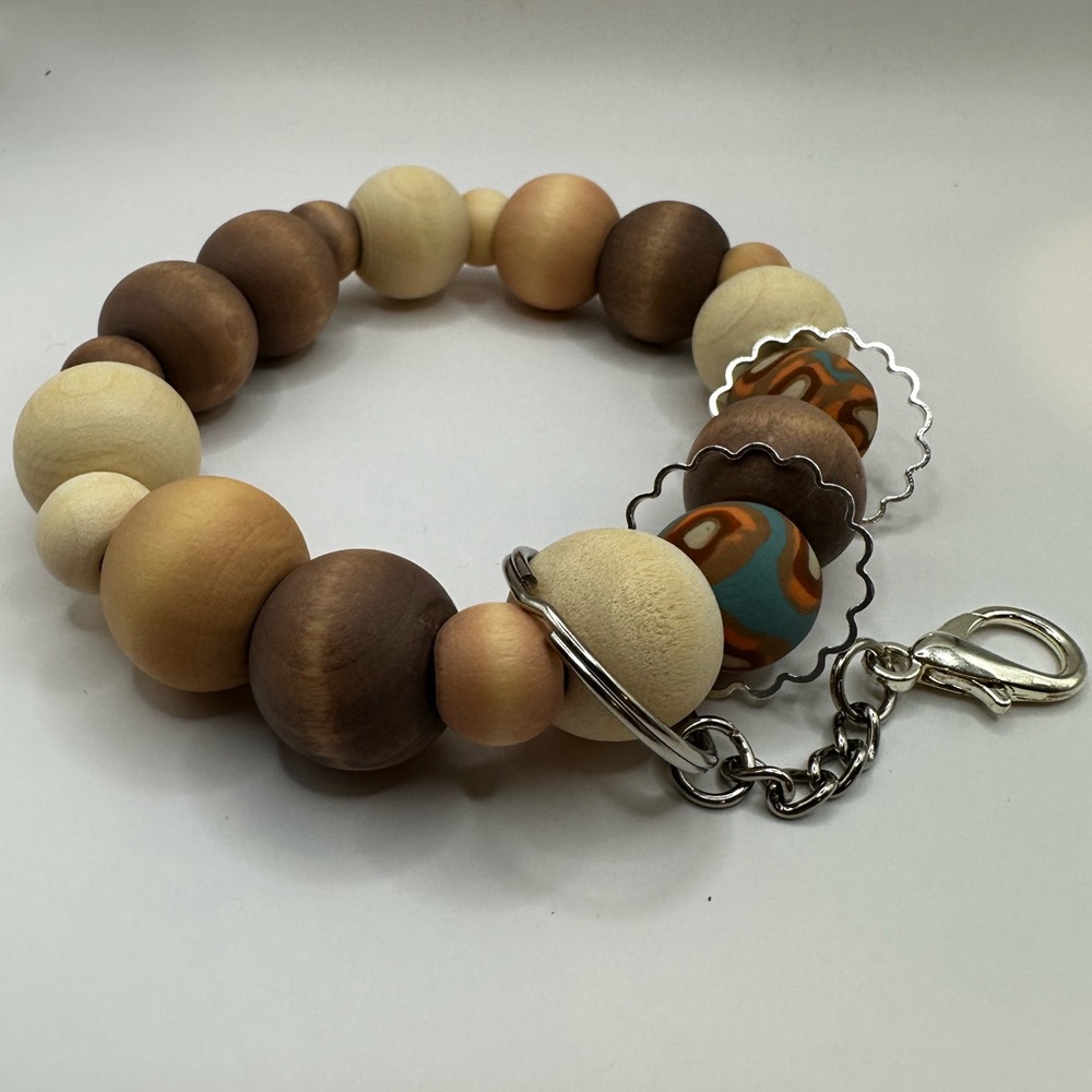 10.5" wristlet/keychain. Handmade using wooden and handmade polymer clay beads